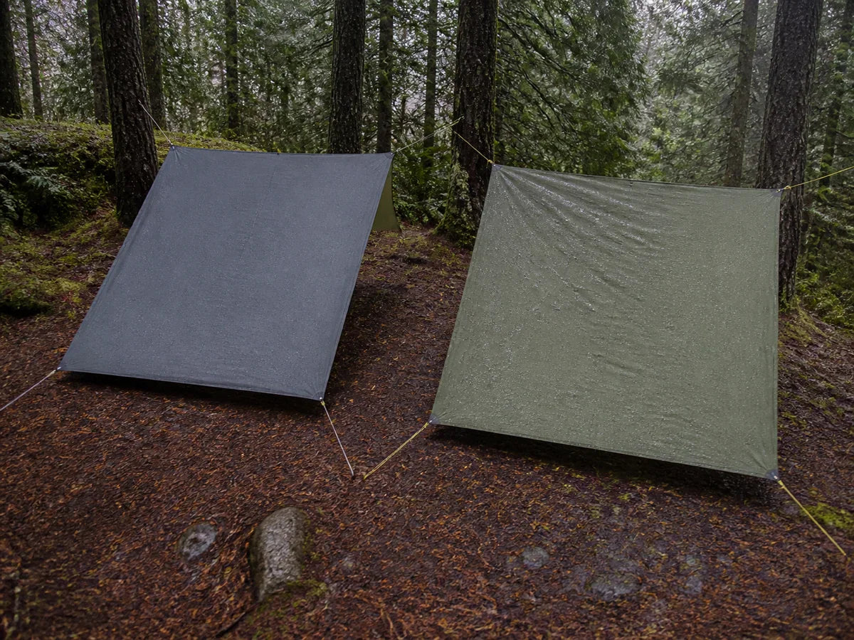Two single-slope square tarps compared in rain, one taut and one slightly relaxed